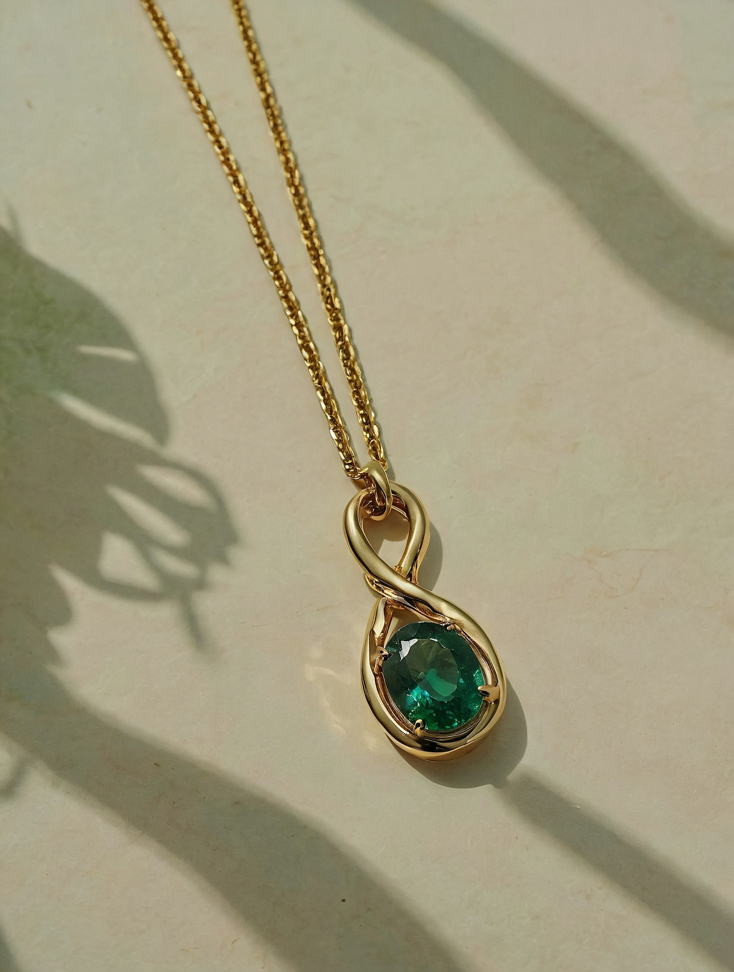 Elegant Gold Necklace with Green Gemstone