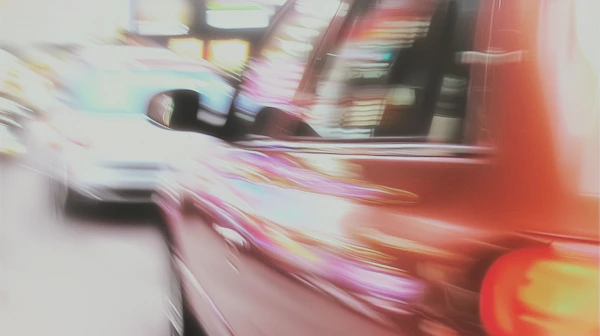 Blurred Red Car Scene