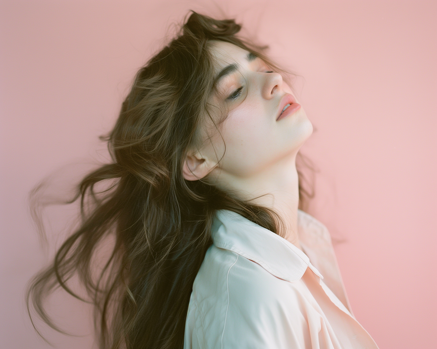 Contemplative Young Woman with Flowing Dark Hair