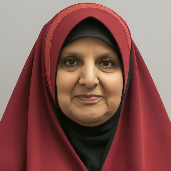 Portrait of a Mature Woman in Red Hijab
