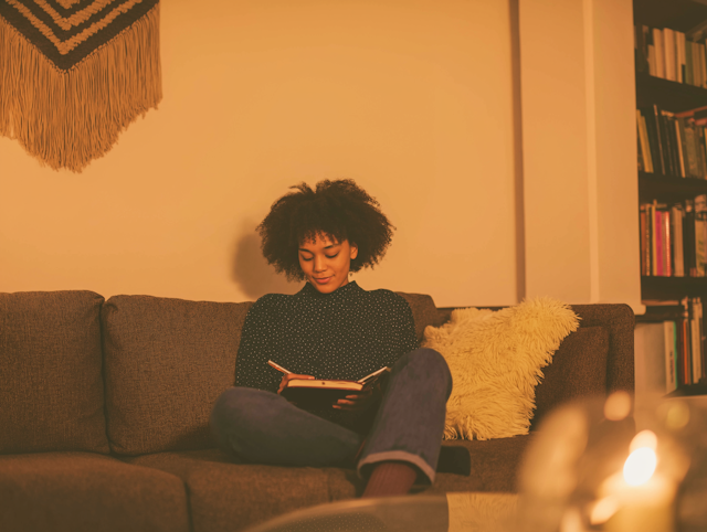 Woman Reading on Couch