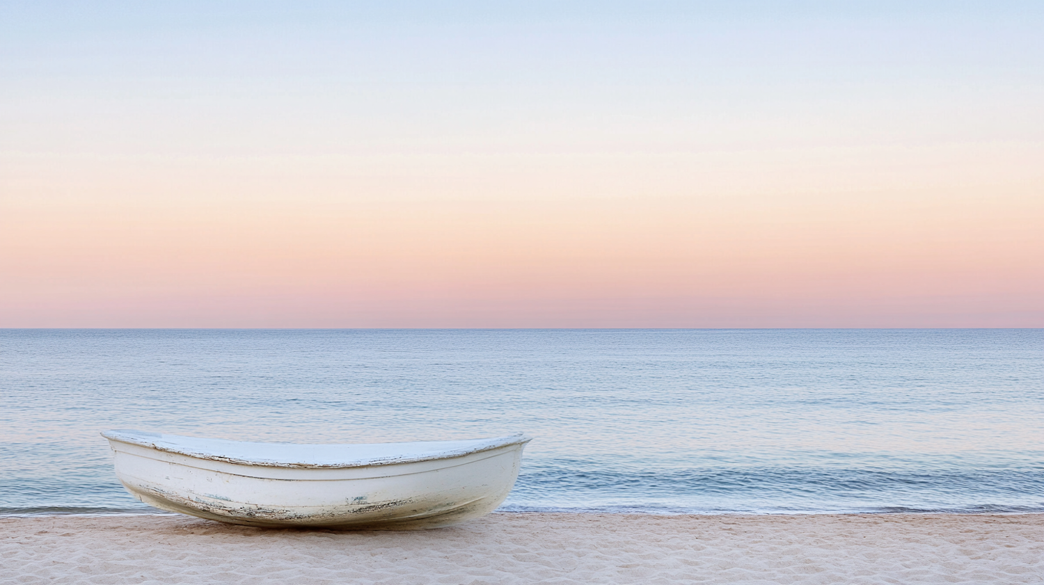 Serene Beach Scene with Weathered Boat