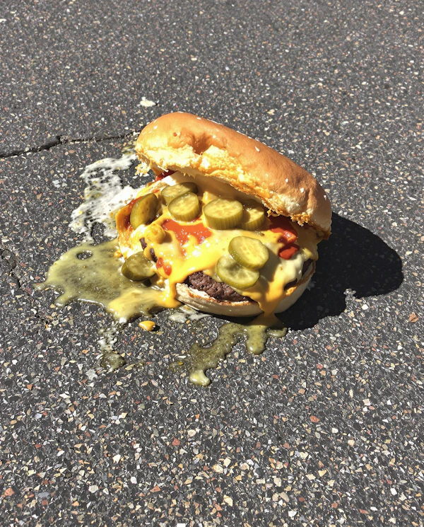 Cheeseburger on Asphalt