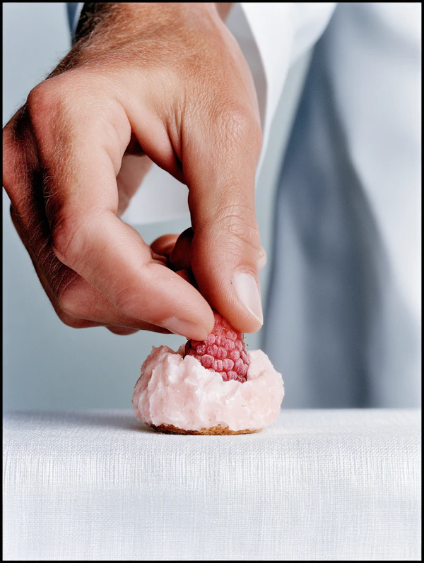 Hand Placing Raspberry