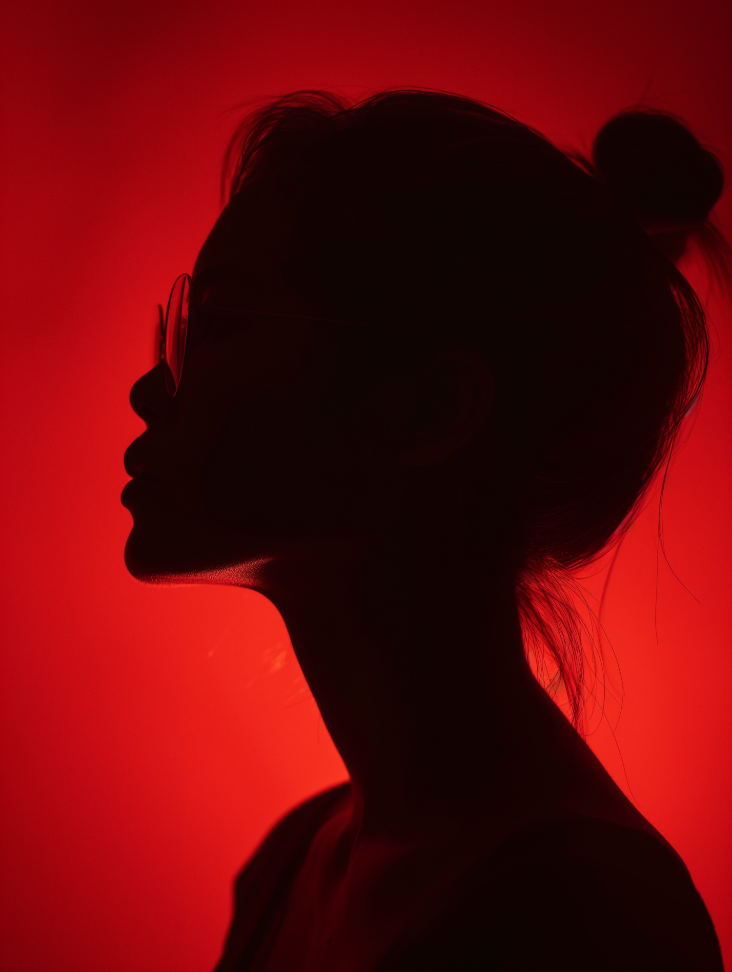 Silhouette of Woman Against Red Background