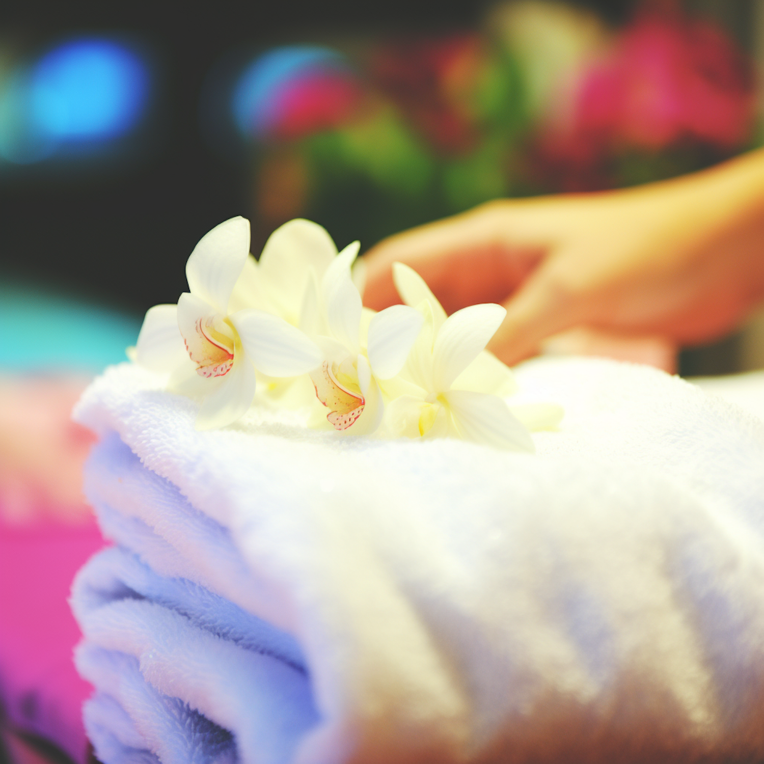 Serenity in Bloom: Orchids on Plush White Towel