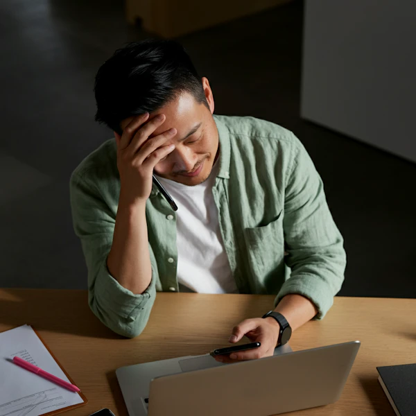 Man at Desk with Devices