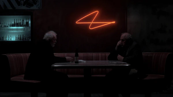Elderly Men in Dimly Lit Booth