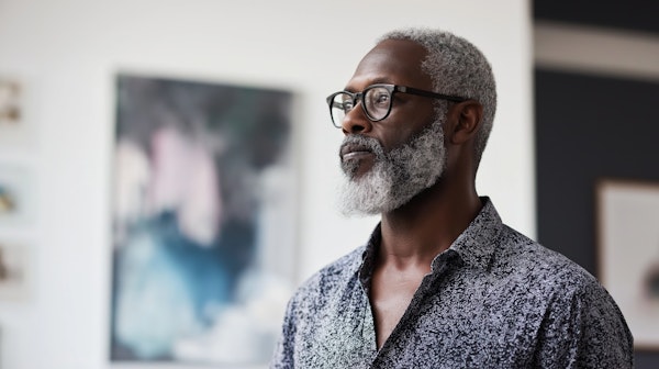 Contemplative Man in Art Gallery