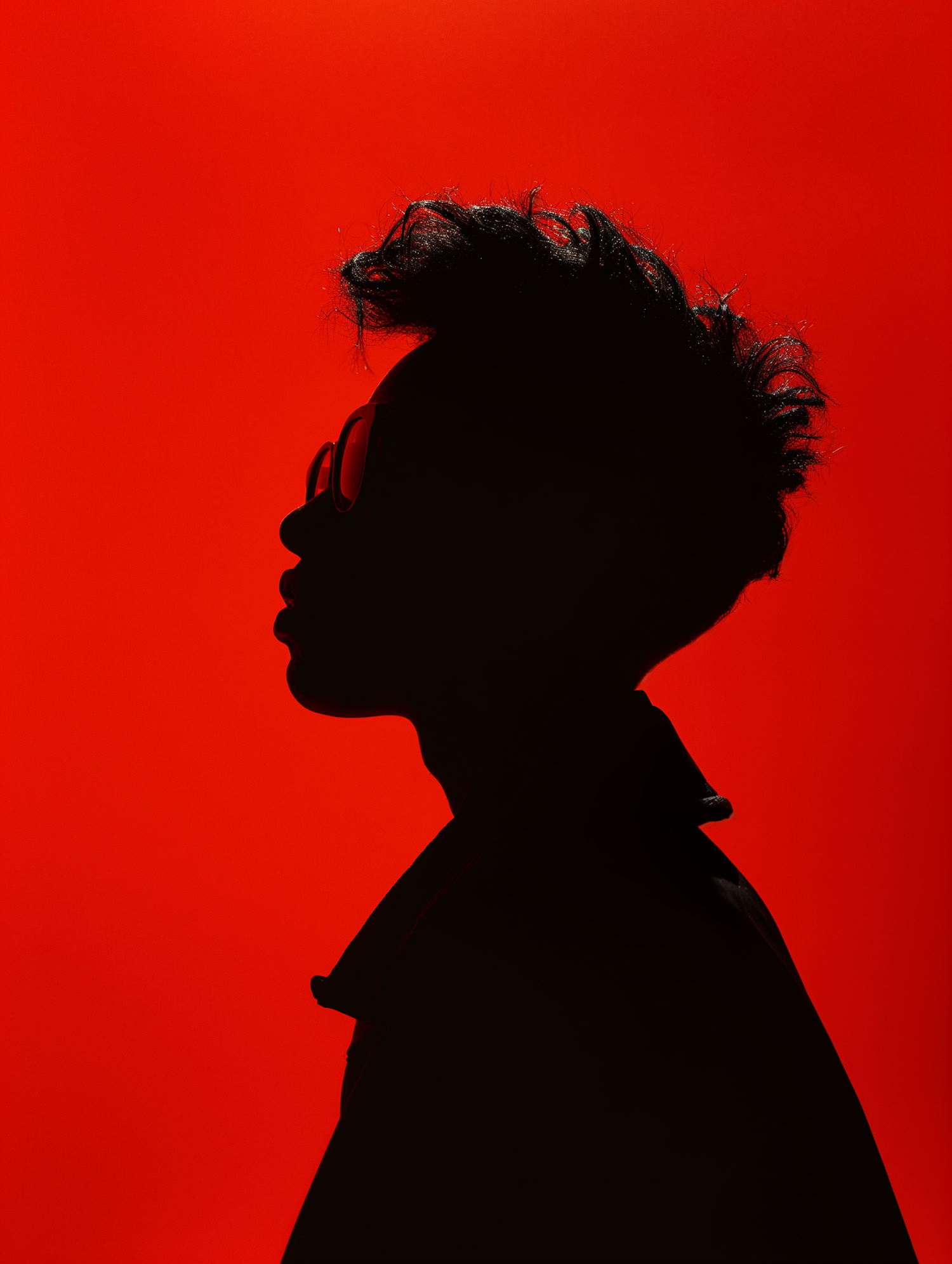 Contemplative Silhouette in Red