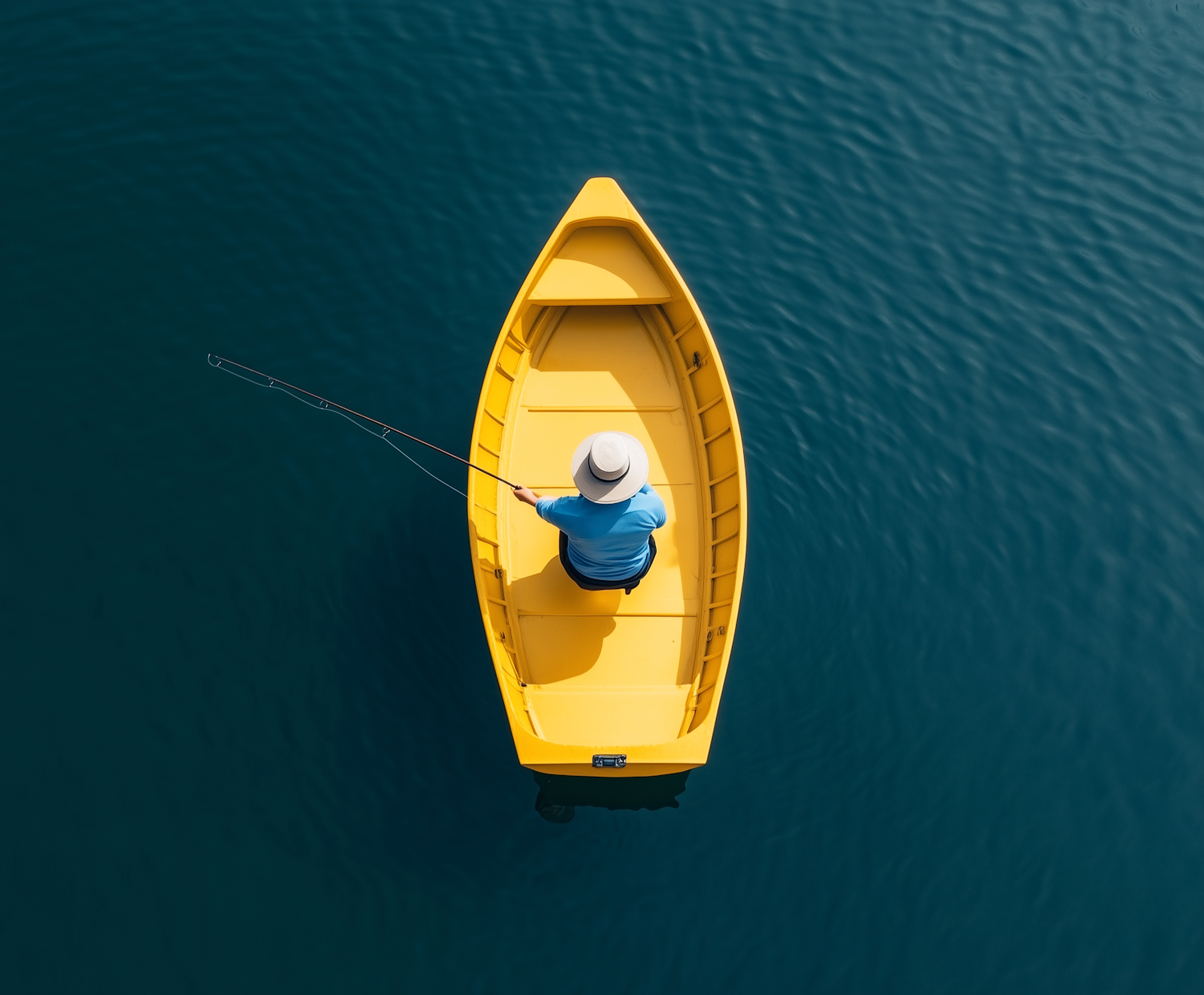 Solitary Fisher in Yellow Boat