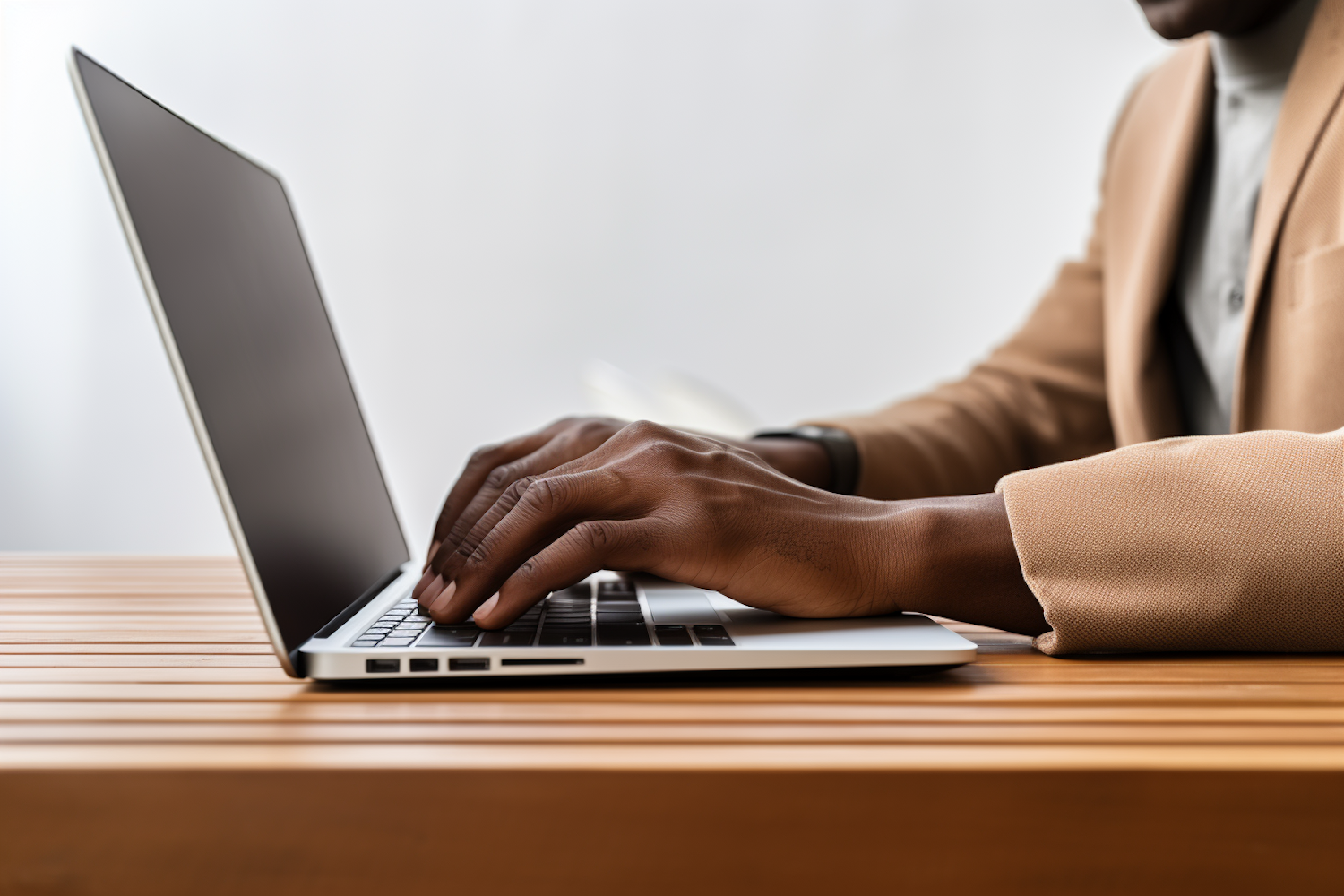 Professional Brown-Skinned Hands Typing on a Modern Laptop