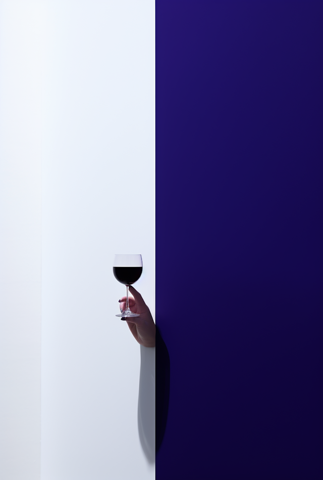 Elegance in Contrast: Hand with Wine Glass