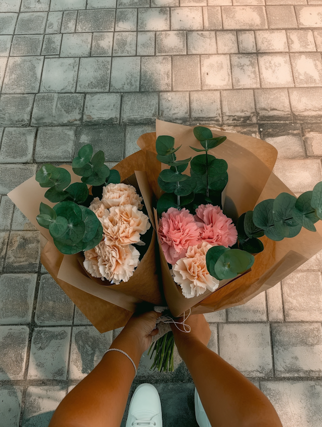 Person Holding Flower Bouquets