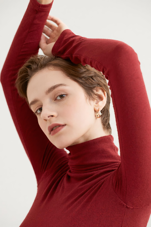 Person in Red Turtleneck