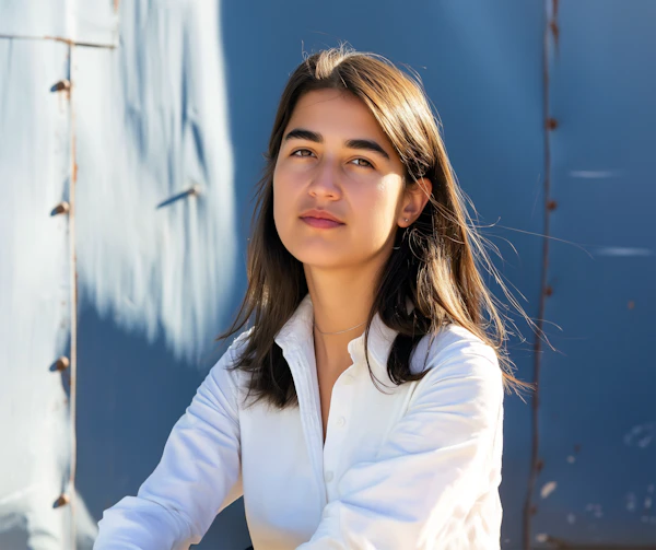 Contemplative Young Woman with Blue Rustic Background