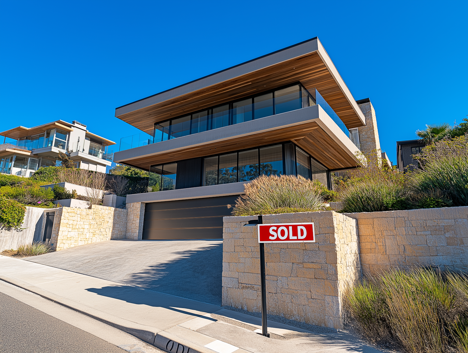 Modern Multi-Story House with SOLD Sign