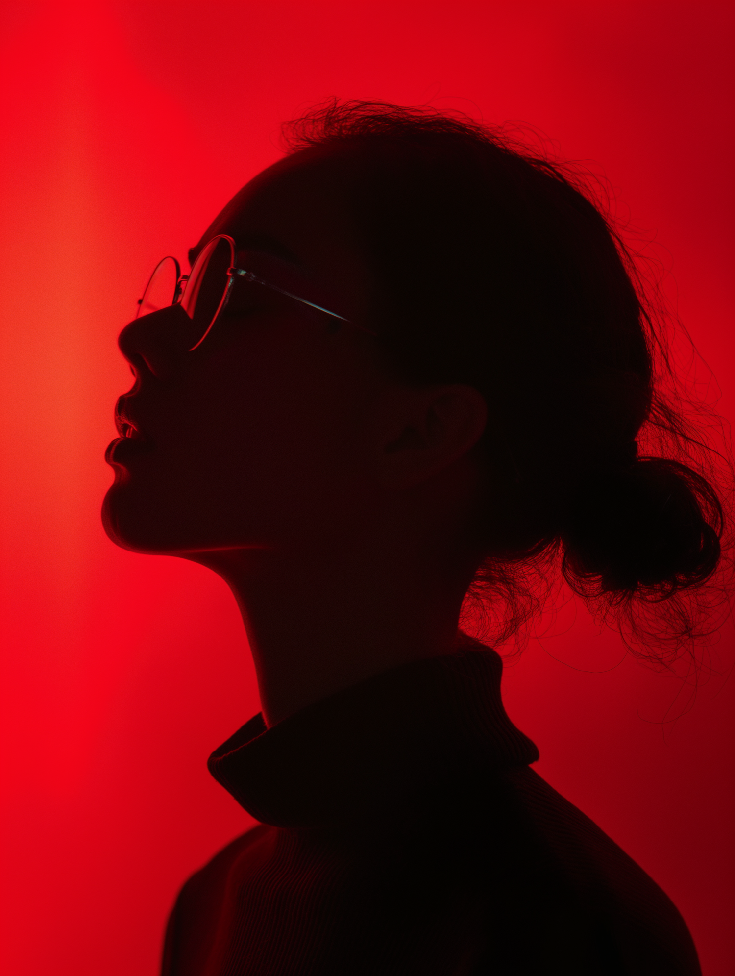 Silhouetted Woman Against Red Backdrop
