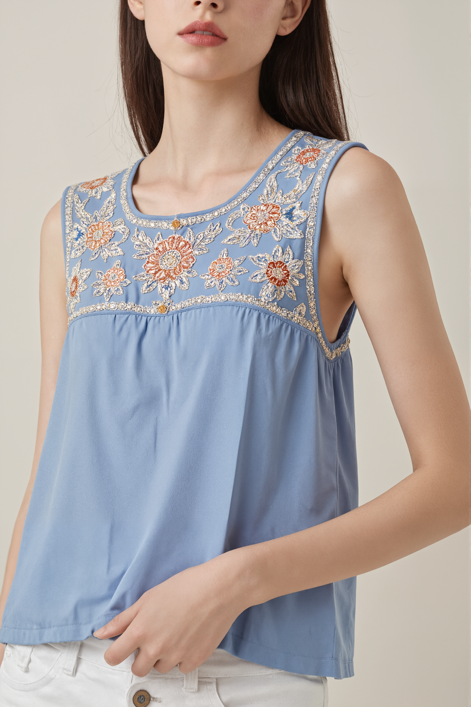 Woman in Embroidered Blue Top