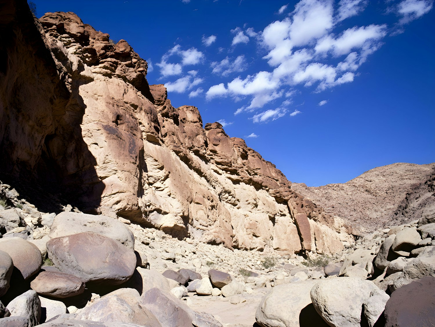 Rugged Landscape with Cliffs and Blue Sky