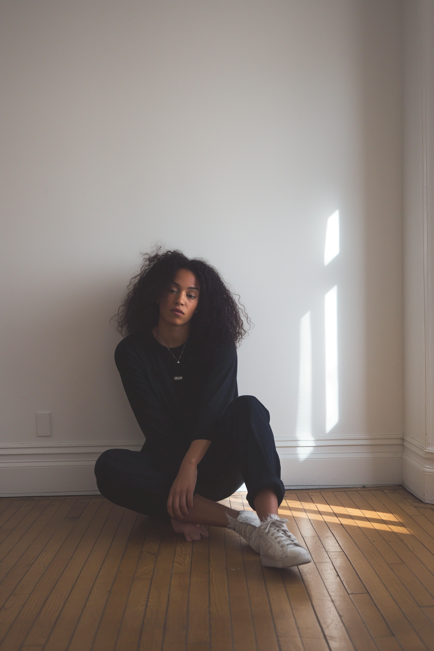 Contemplative Young Woman in Sunlit Room