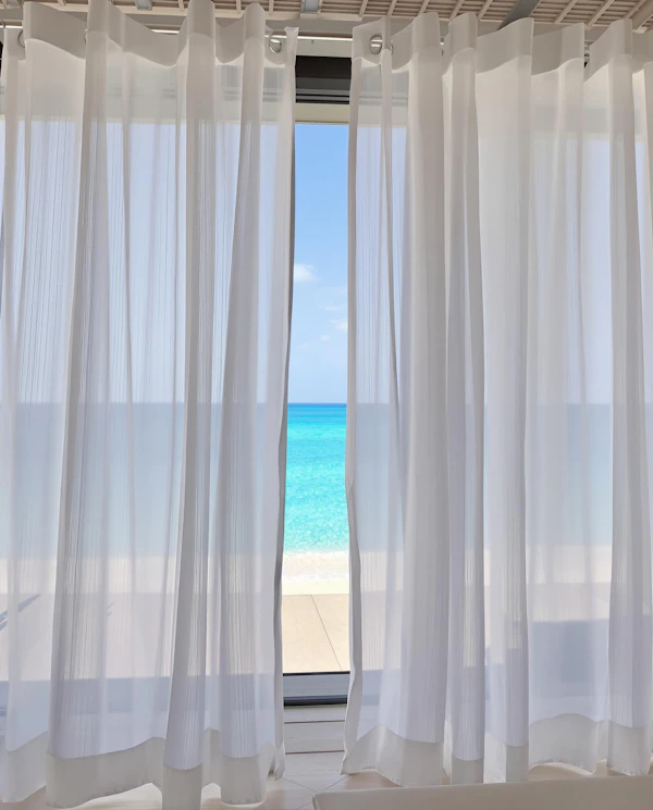 Ocean View Through Curtains