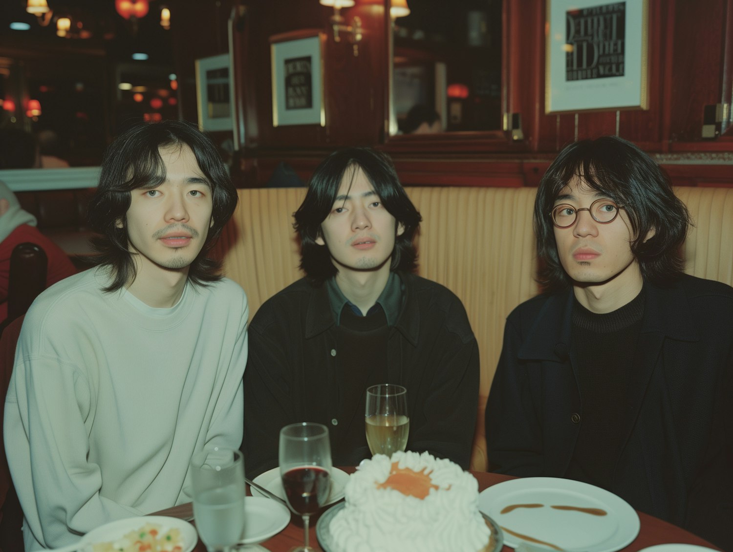 Three Men Seated in Diner