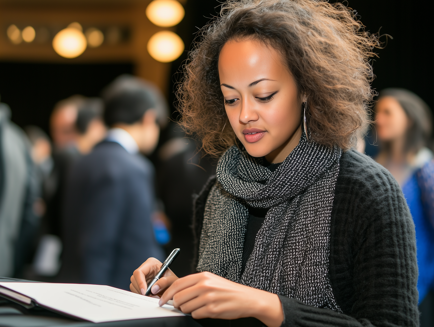 Focused Woman Writing in Notebook