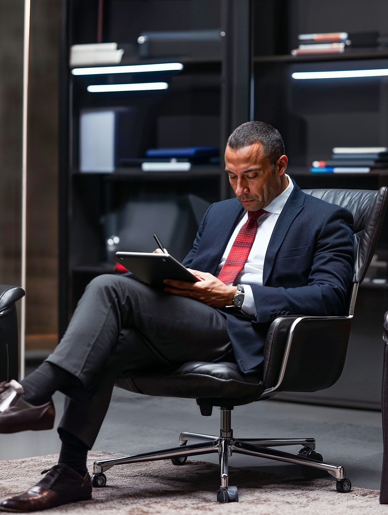 Man Working on Tablet in Modern Office