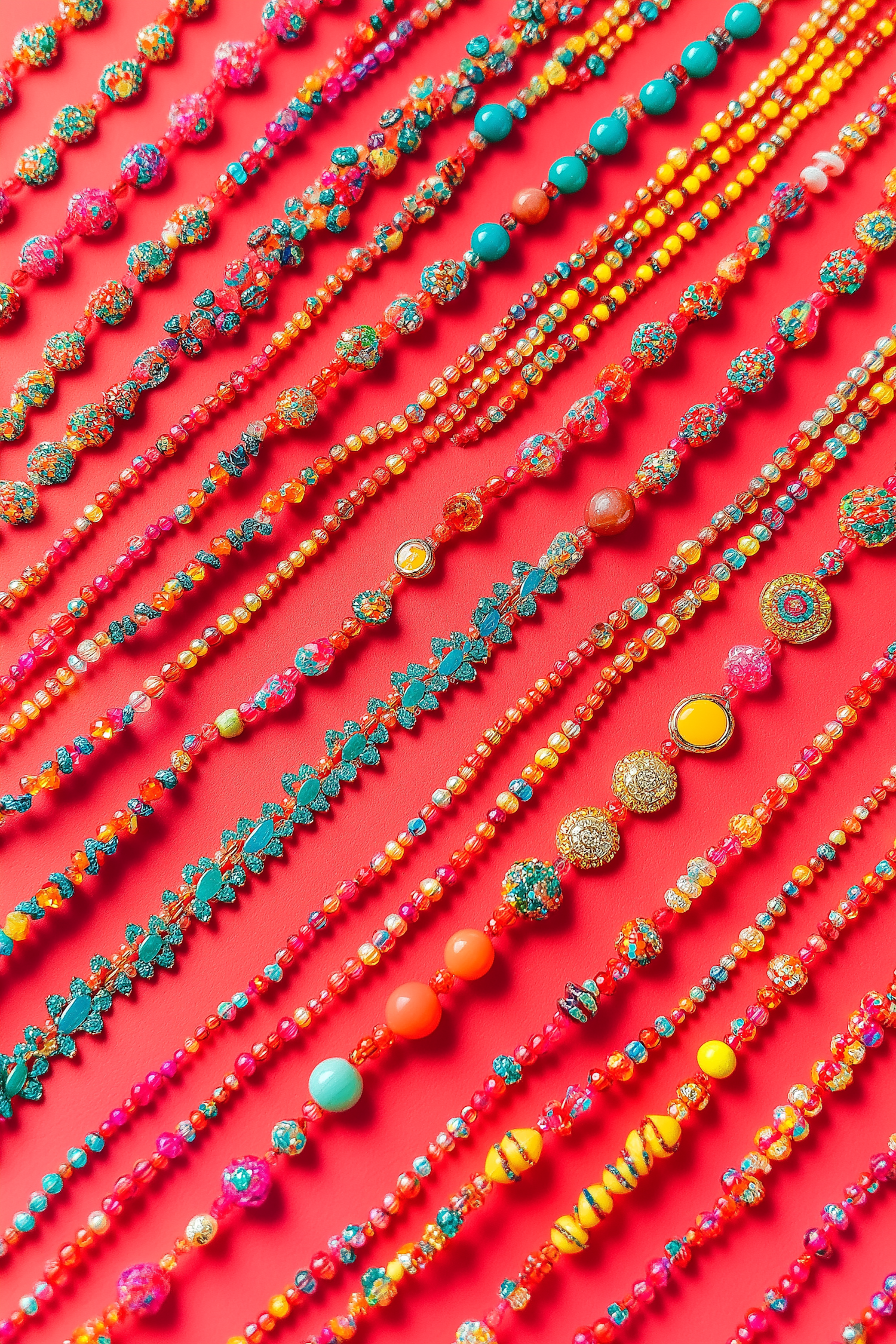 Colorful Beaded Necklaces on Red Background