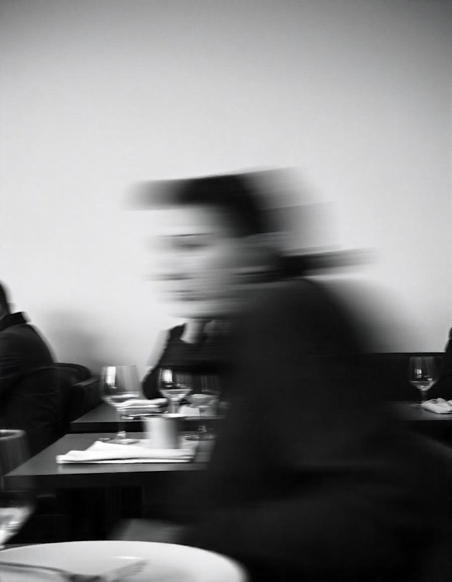 Blurred Figure in Restaurant