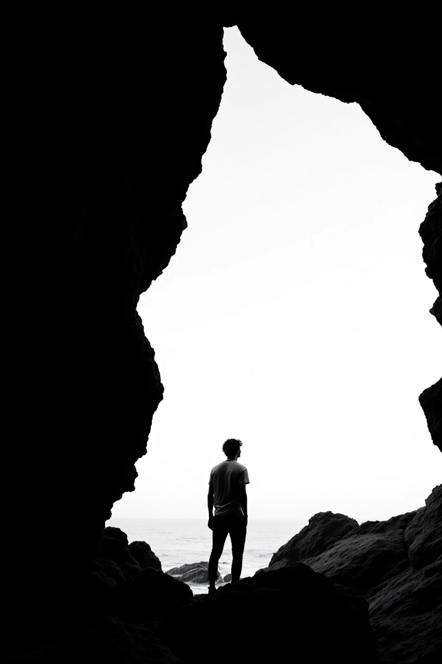 Silhouette at Cave Entrance