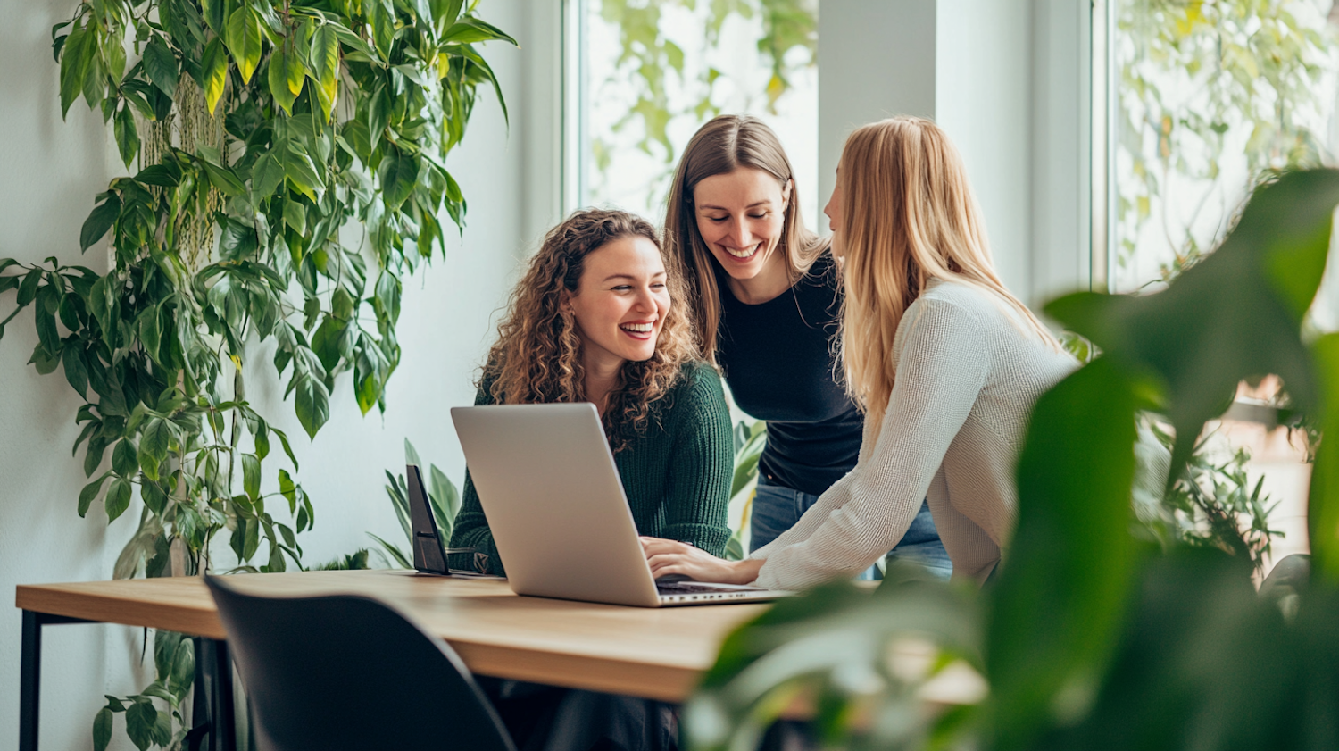 Women Collaborating Around Laptop