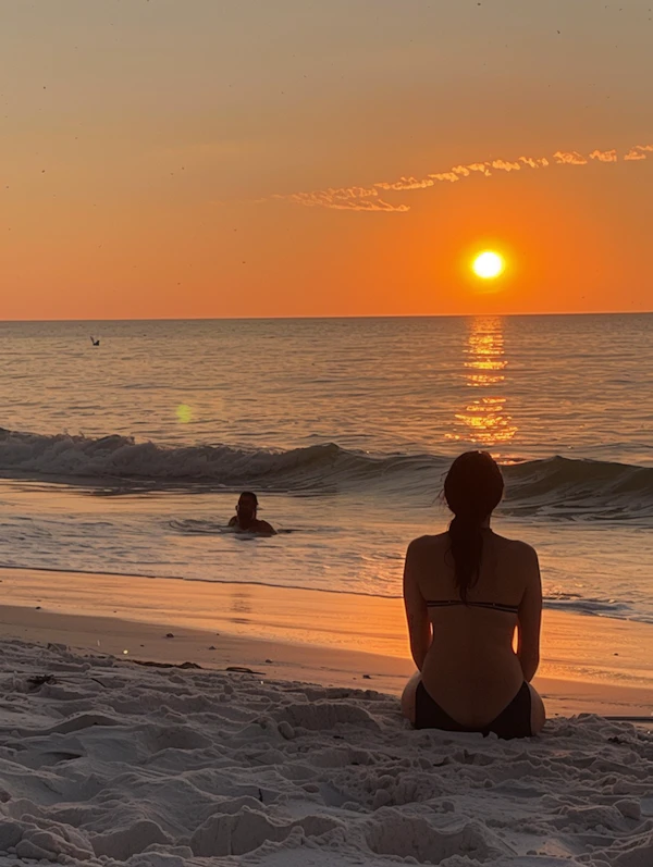 Serene Beach Sunset with Seated Woman