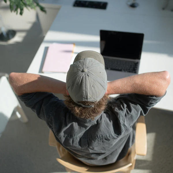 Person Relaxing at Desk