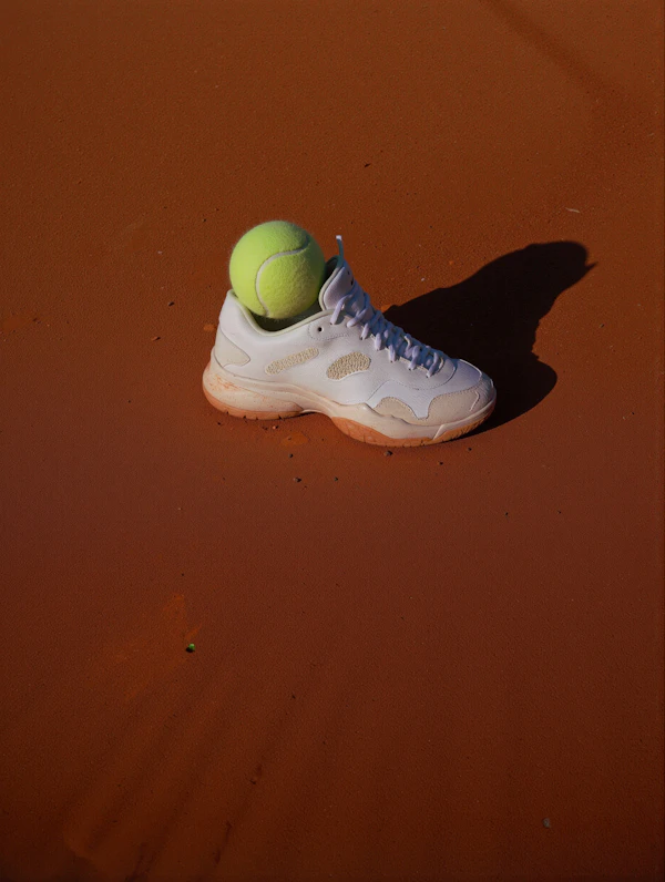 Tennis Shoe and Ball