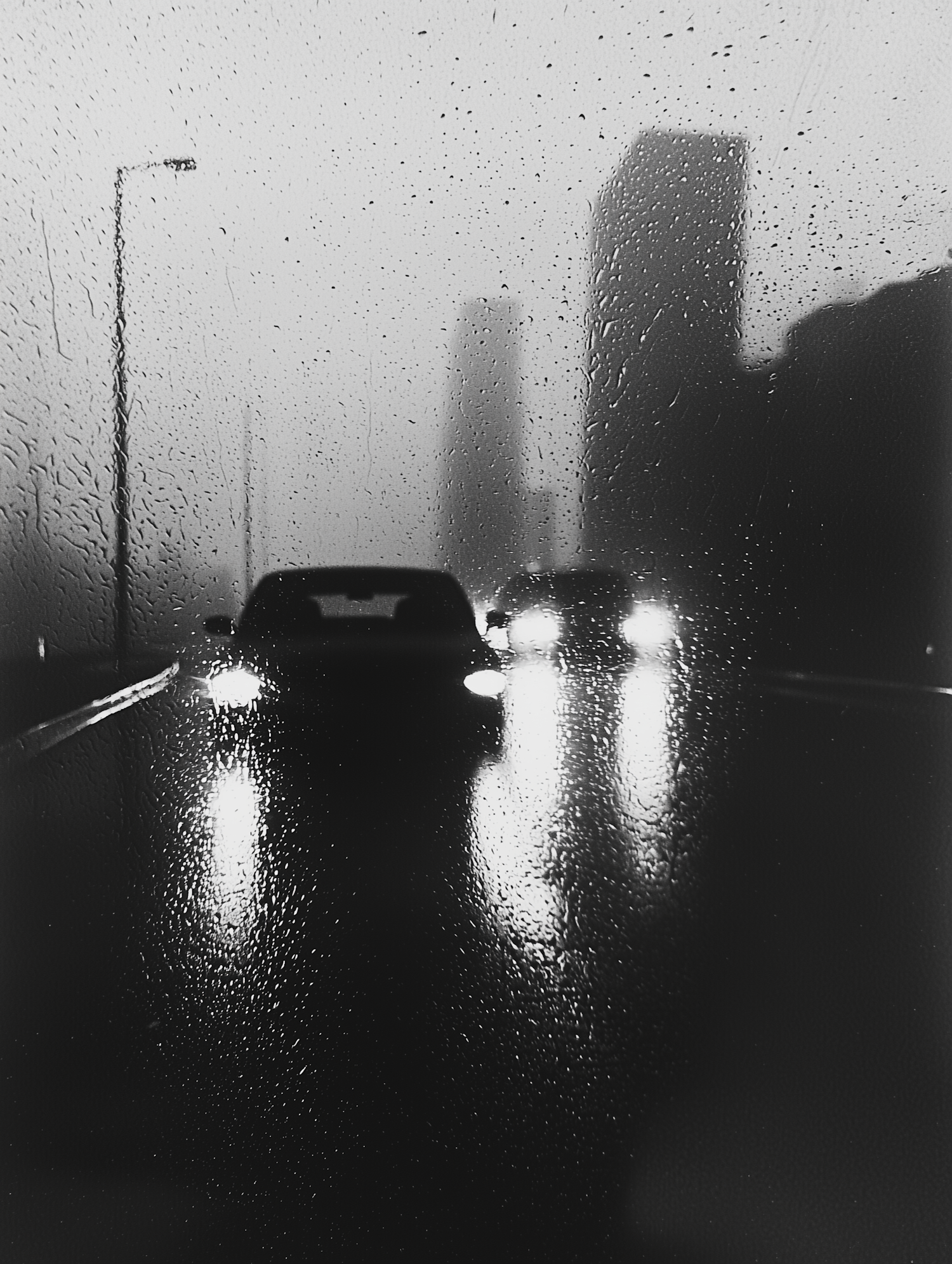 Rainy Urban Scene with Cars