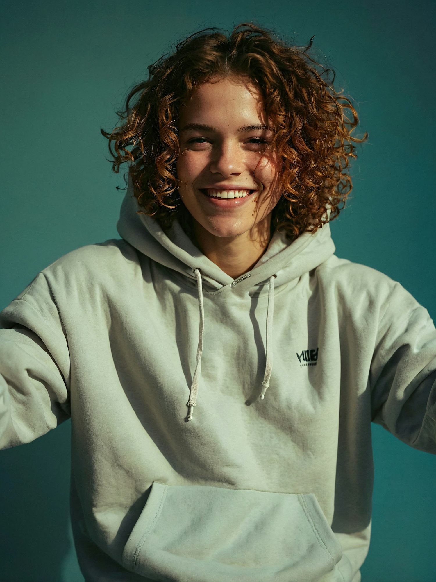 Smiling Person in Hoodie