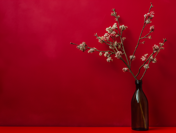 Minimalist Composition with Amber Glass Bottle and Dried Flowers