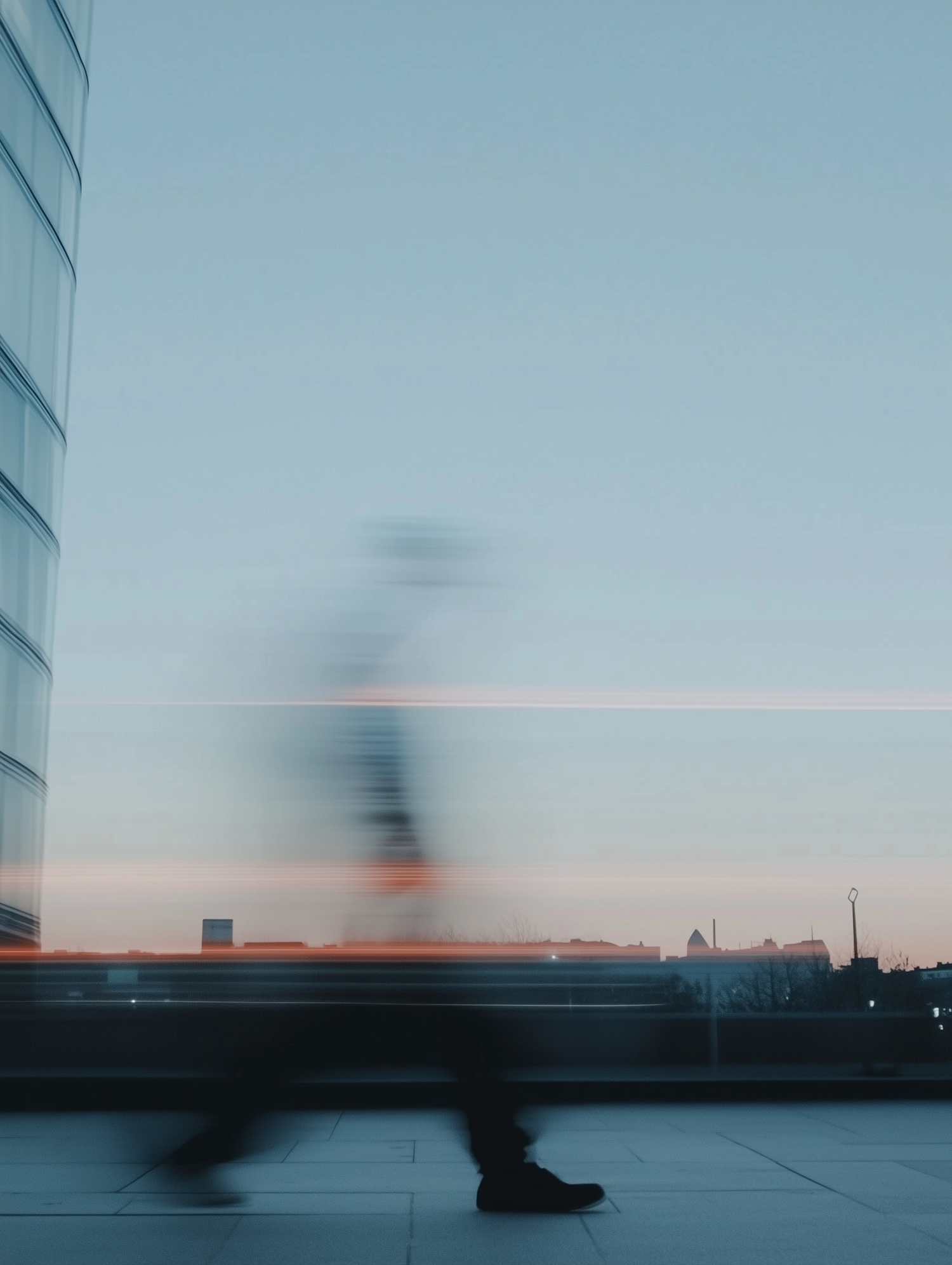 Cityscape at Dusk with Blurred Figure