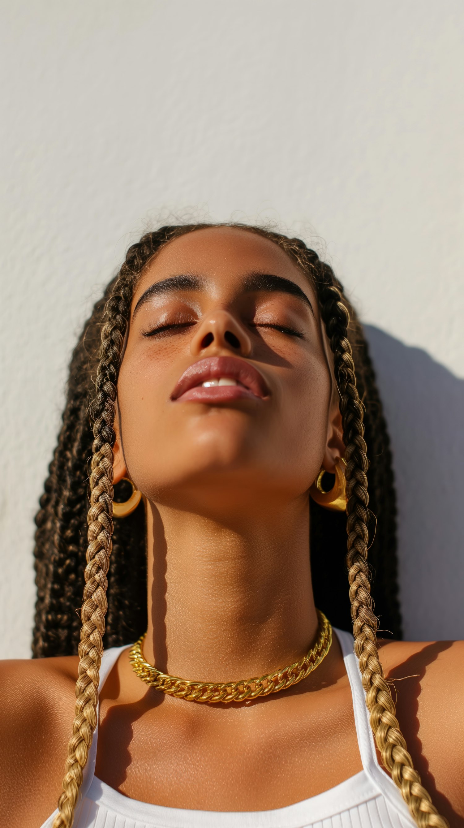 Serene Portrait of Young Woman with Golden Jewelry