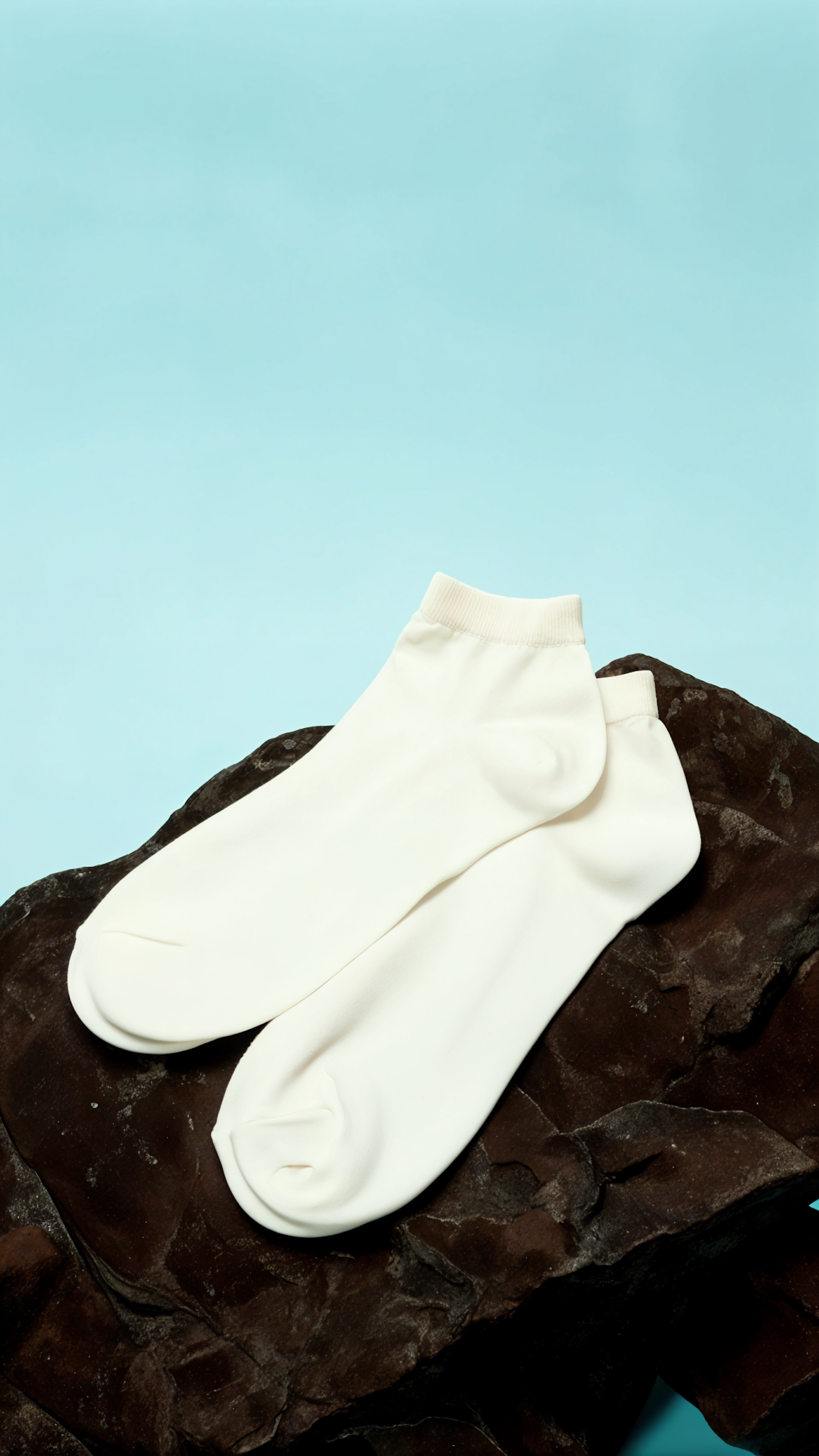 Minimalist White Socks on Textured Surface