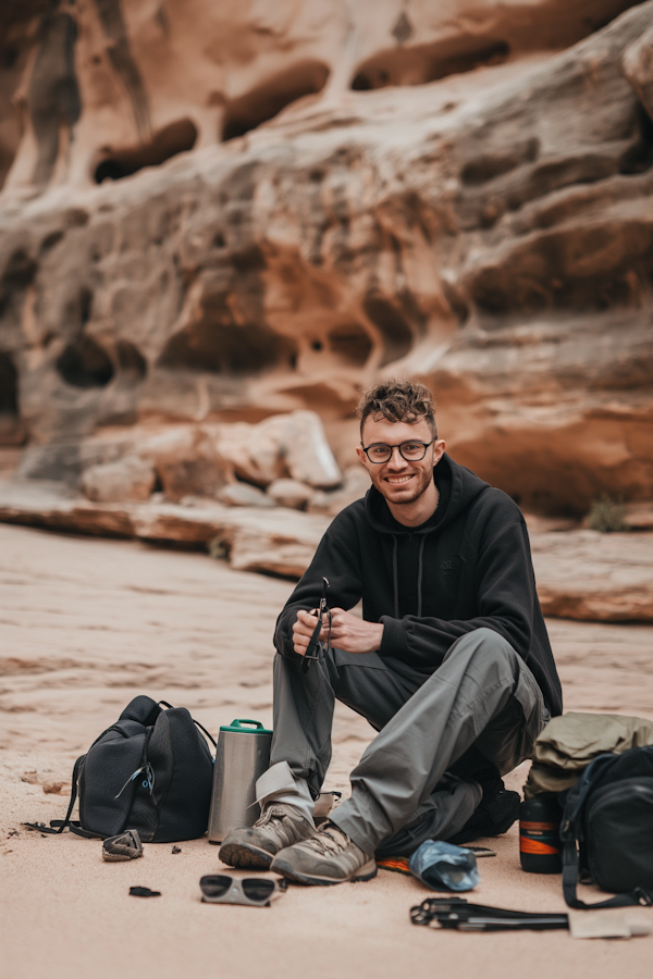 Man Seated in Desert Landscape