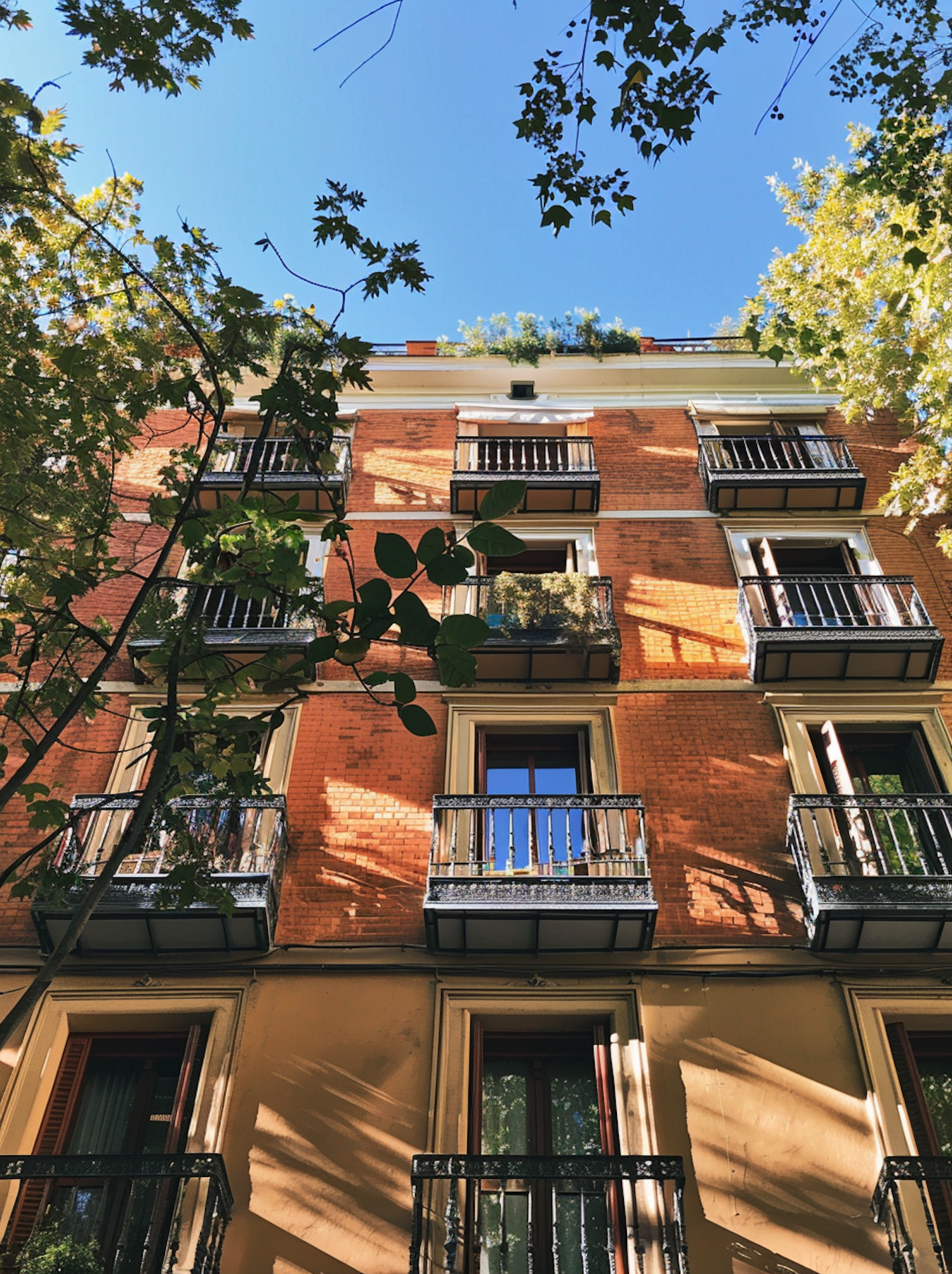 Traditional Brick Building with Wrought-Iron Balconies