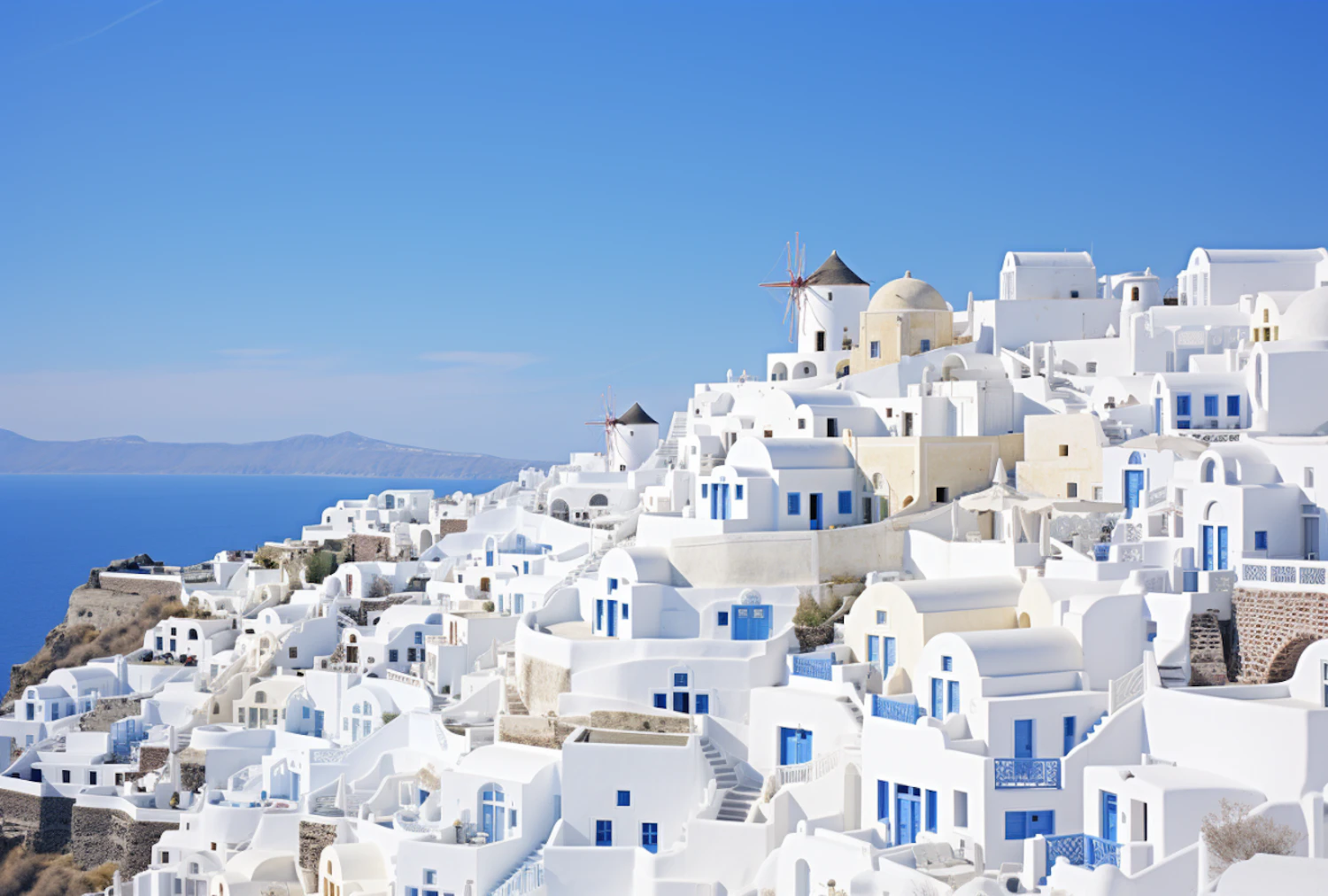 Whitewashed buildings and blue domes overlooking the Aegean Sea