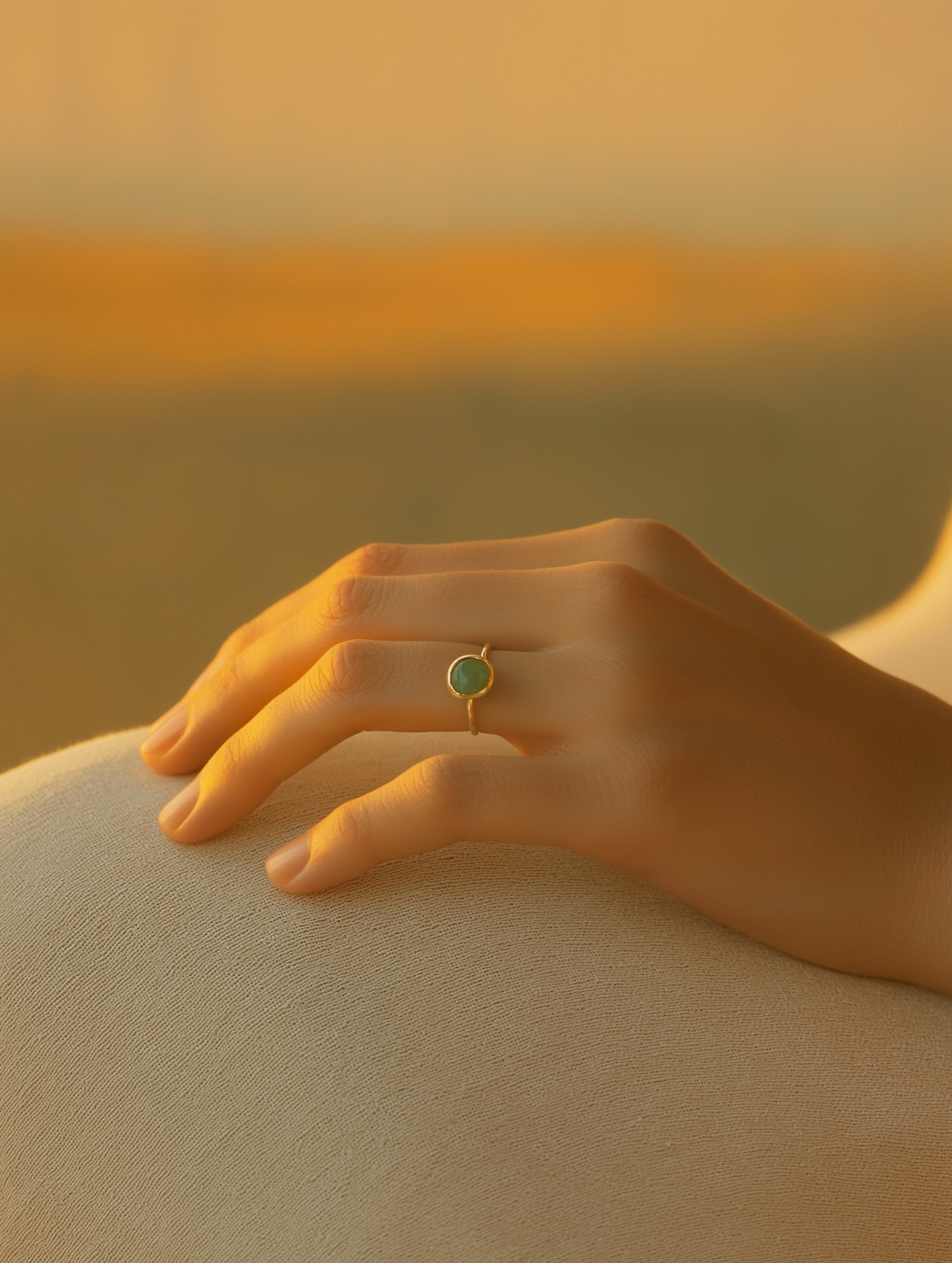 Hand with Green Gemstone Ring