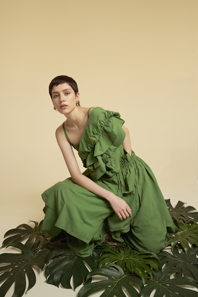 Elegant Green Dress Amidst Leaves