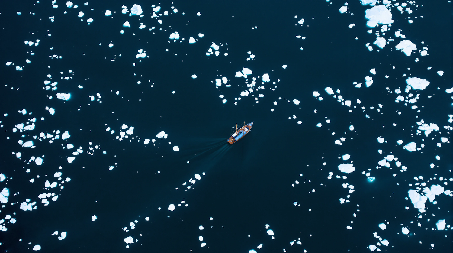 Lone Boat in Icy Waters