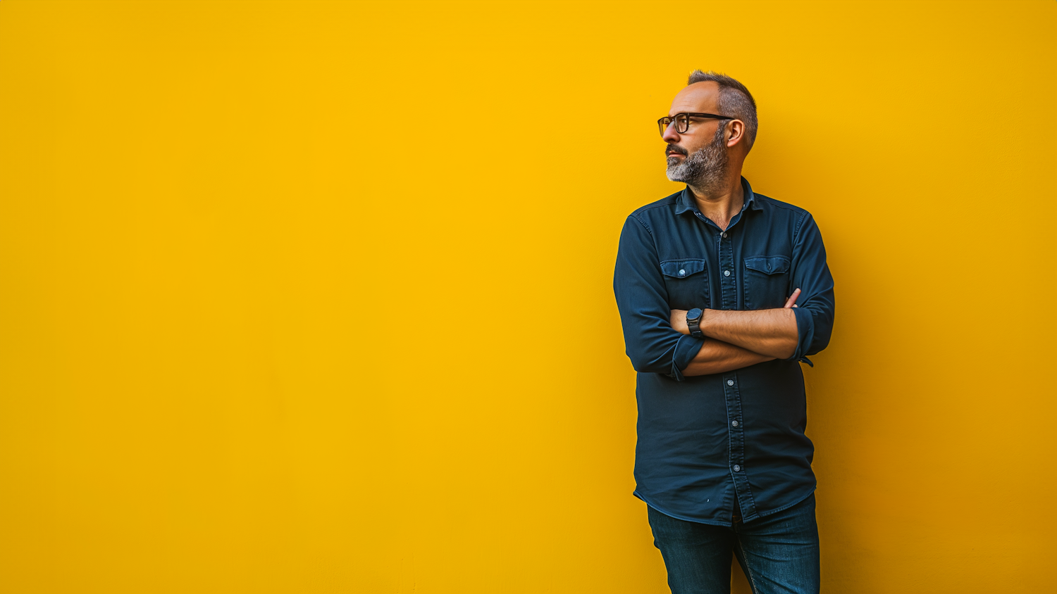 Contemplative Professional with Yellow Backdrop