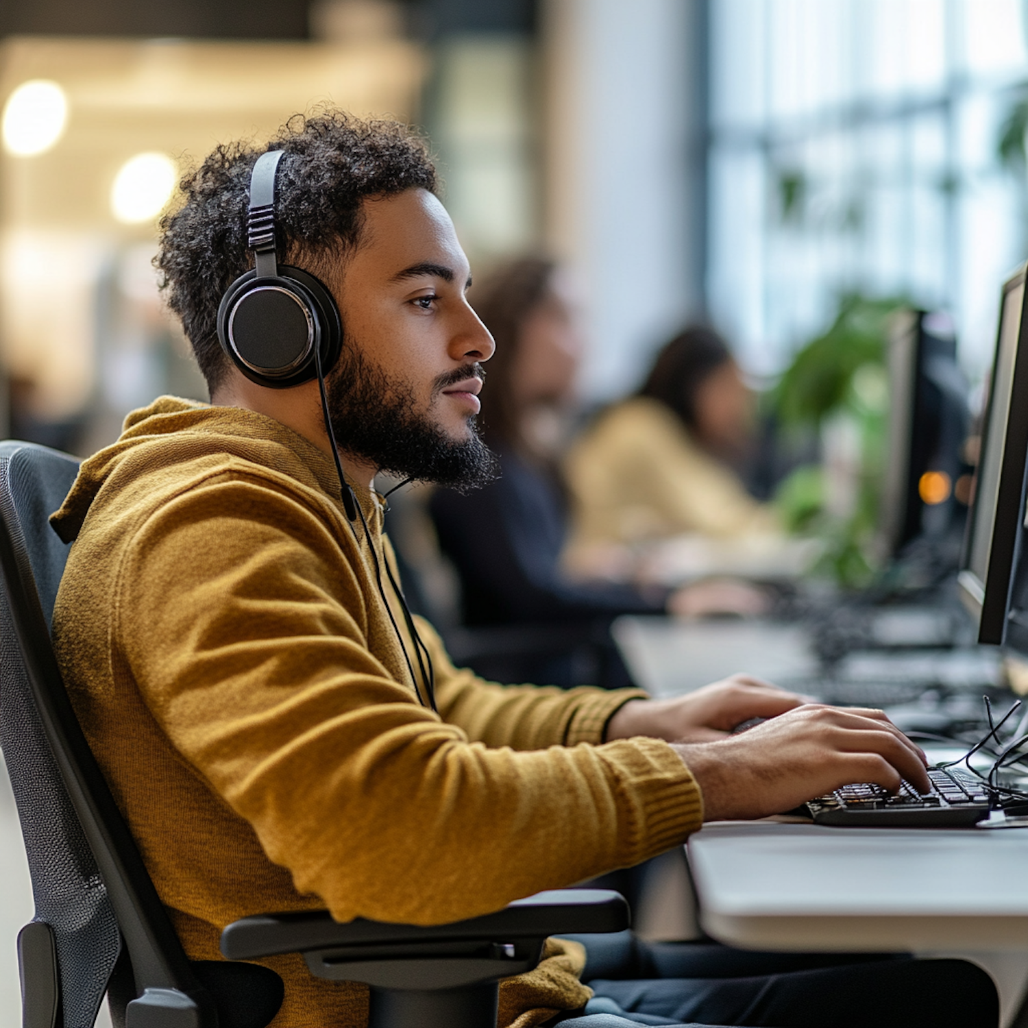 Man Working on Computer at Desk